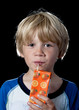Boy drinking orange juice