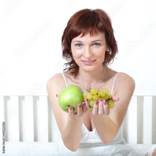 Photo: Beautiful young woman with fruit Beautiful young woman with fruit