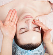 Beautiful woman with clear skin getting beauty treatment at salo
