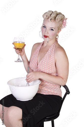 Photo: Sexy Retro Woman Cooking while Smoking and Drinking Sexy Retro Woman Cooking while Smoking and Drinking