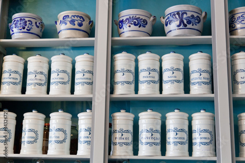 Photo: Ancient capacities with spices on shop regiments Ancient capacities with spices on shop regiments