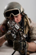 Soldier with rifle against white background.