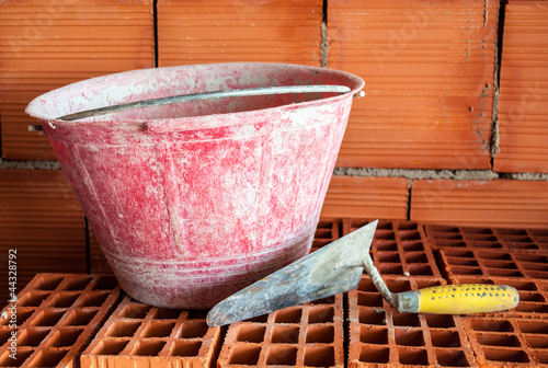 Photo: Trowel, bucket and bricks Trowel, bucket and bricks