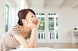Photo: Beautiful young woman relaxing in the room Beautiful young woman relaxing in the room