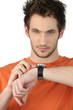Casual young man checking his wrist watch