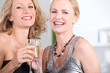 two women drinking champagne