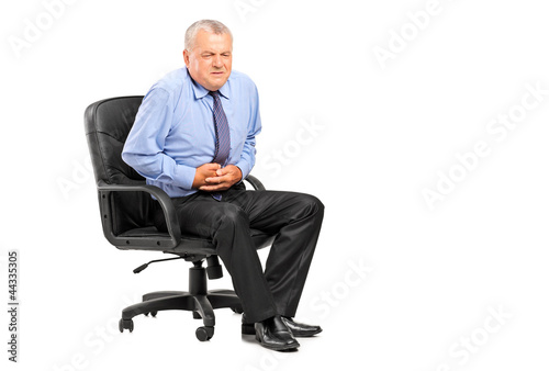 Photo: Businessman having a stomach ache Businessman having a stomach ache