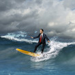 Young business person surfing on the waves