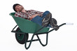 Worker taking a nap in wheelbarrow