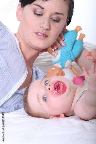 Photo: Woman playing with her baby Woman playing with her baby
