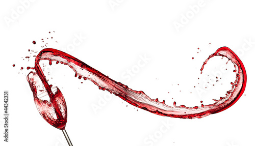 Photo: Red wine splashing out of glass, isolated on white background Red wine splashing out of glass, isolated on white background