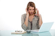 angry businesswoman looking at her laptop
