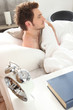 man waking up in his bed