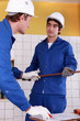 craftsman and his apprentice working together