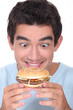 Man holding cheeseburger