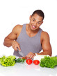 Portrait of muscle man posing in kitchen
