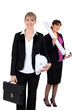 An architect standing in front of her colleague