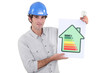 Constructor holding energy rating sign
