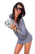 Photo: Portrait of sexy woman posing in studio in grey dress Portrait of sexy woman posing in studio in grey dress