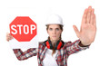 Woman holding stop sign