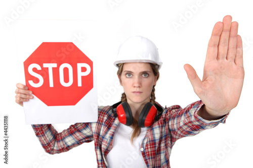 Photo: Woman holding stop sign Woman holding stop sign