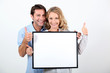 woman and man holding board