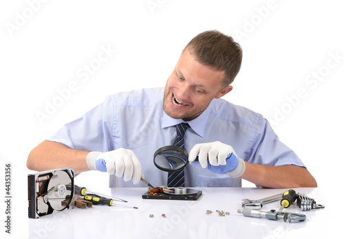 Photo: Crazy man reconditioning hard drive Crazy man reconditioning hard drive