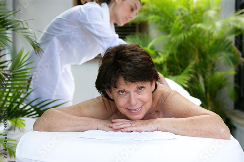 Photo: Mature woman having a massage Mature woman having a massage