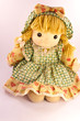 Isolated sweet doll sitting at white background. Soft children t