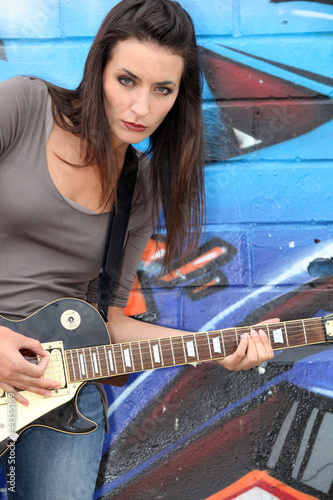 Photo: Urban woman with a guitar Urban woman with a guitar
