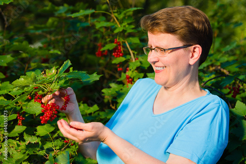 Photo: Redcurrant and woman Redcurrant and woman