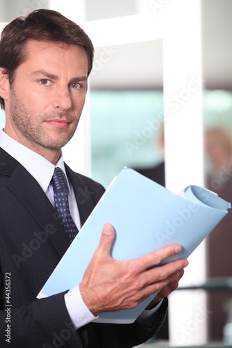 Photo: Executive reading report Executive reading report