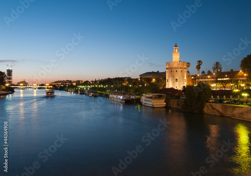 Photo: view of river Guadalquivir in Seville with Golden Tower (Torre d view of river Guadalquivir in Seville with Golden Tower (Torre d