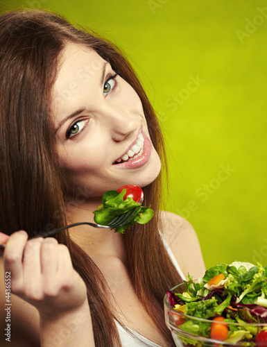 Photo: woman eating salad woman eating salad