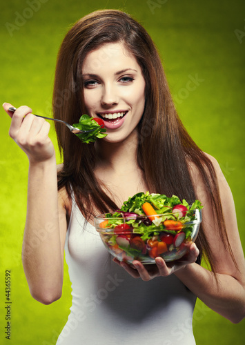 Photo: woman eating salad woman eating salad