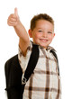 Photo: Happy schoolboy wearing backpack and giving thumbs up Happy schoolboy wearing backpack and giving thumbs up