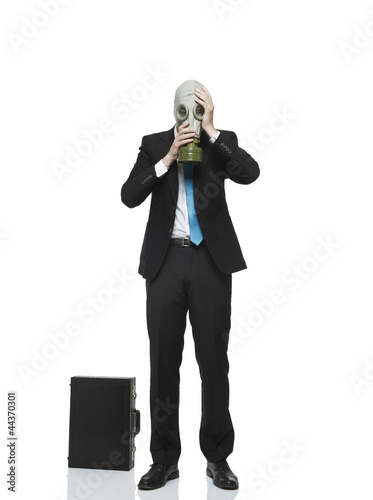 Photo: businessman mit gasmaske businessman mit gasmaske