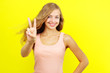 Teenage girl showing victory sign
