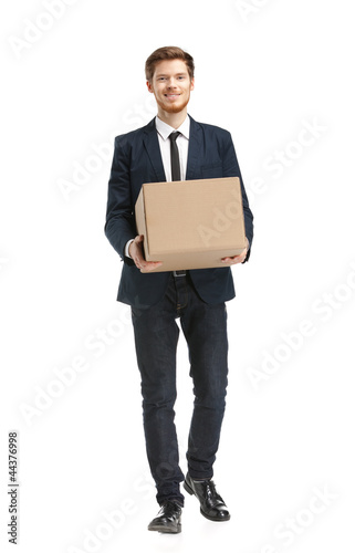 Photo: Shop assistant brings the parcel, isolated, white background Shop assistant brings the parcel, isolated, white background