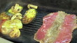 Steak and vegetable on grill