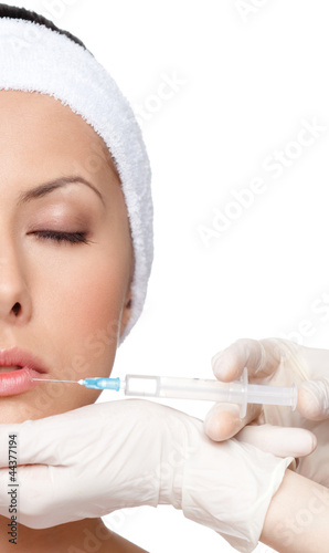 Photo: Botox lips correction, half-viewed face, isolated Botox lips correction, half-viewed face, isolated