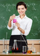 Smiley chemistry teacher holds a conical flask