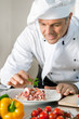 Foto: Smiling chef at work Smiling chef at work