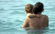 baby and his mother in the sea