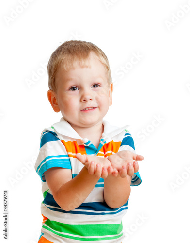 Photo: Little child boy reaching his hands out, isolated on white Little child boy reaching his hands out, isolated on white