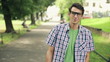 Video: Happy young man walking in the park, steadicam shot Happy young man walking in the park, steadicam shot