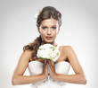 A young and attractive Caucasian bride in white clothes