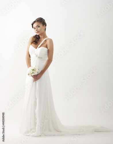Photo: A young and attractive Caucasian bride in white clothes A young and attractive Caucasian bride in white clothes