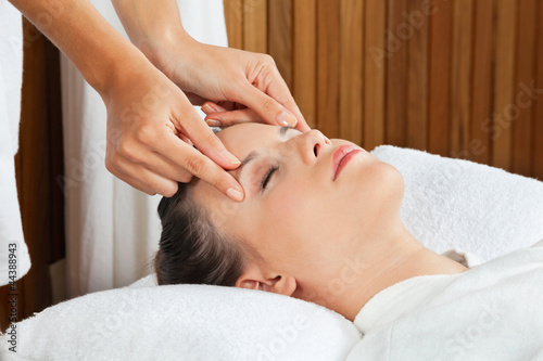 Photo: Female Receiving Head Massage At Spa Female Receiving Head Massage At Spa