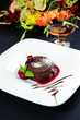 Luscious chocolate dessert with fresh berries on a plate